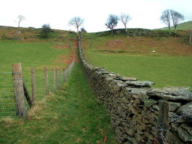 A walking path beside a dry stone wall, representing healthy personal boundaries.